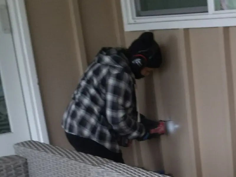 Professional electrician installing an exterior outlet in Bremen